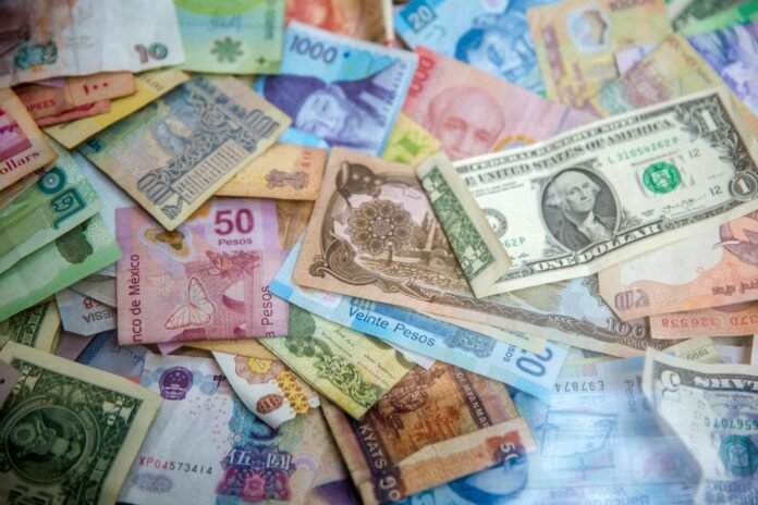 Various international banknotes, representing currency exchange and the naira's exchange rate