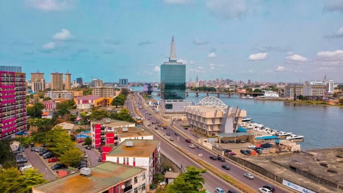 Aerial view of a busy Nigerian city, illustrating urban inflation and city cost of living